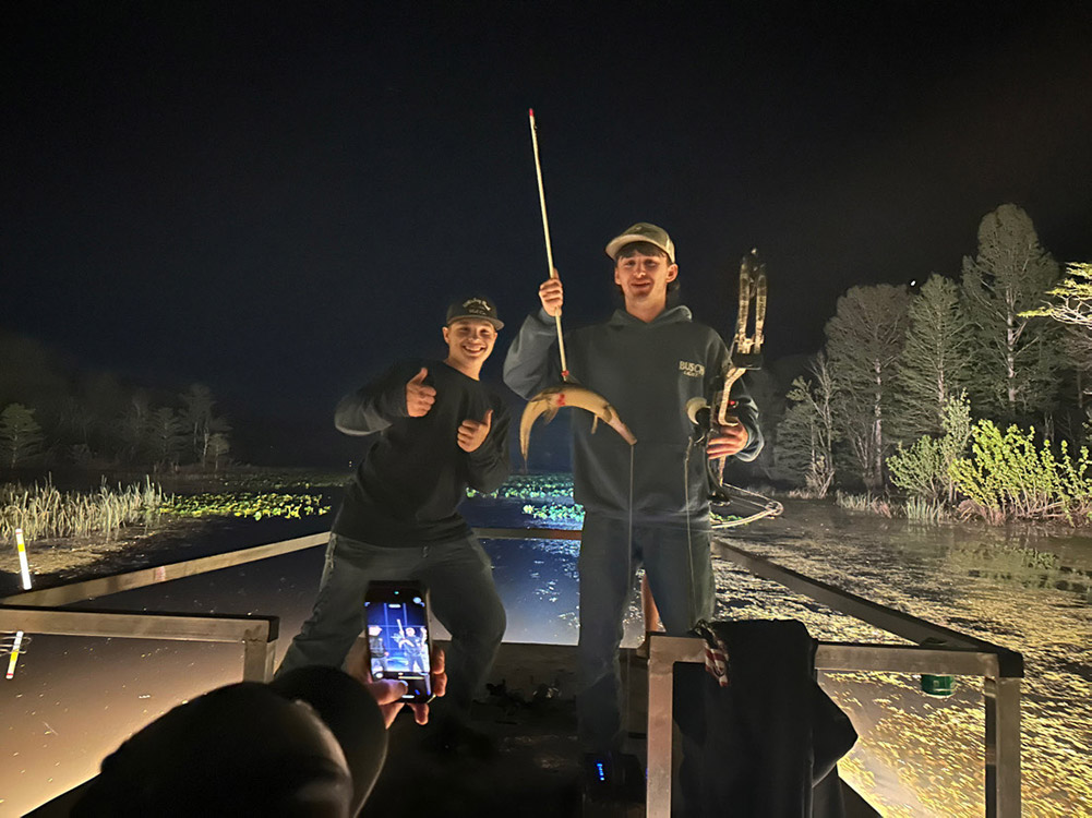 two boys and fish they caught